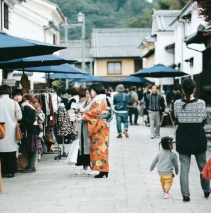 People walking through Ozu's traditional streets